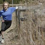 ** ADVANCE FOR WEEKEND EDITIONS APRIL 9-10 ** Jacqueline Gareau stretches prior to running in a park near her home in St. Bruno, Quebec, Canada, Friday, April8, 2005. Gareau won the Boston marathon in 1980 after Rosie Ruiz was disqualified for cheating. (AP PHOTO/Paul Chiasson) Library Tag 04152005 Boston Marathon 2005